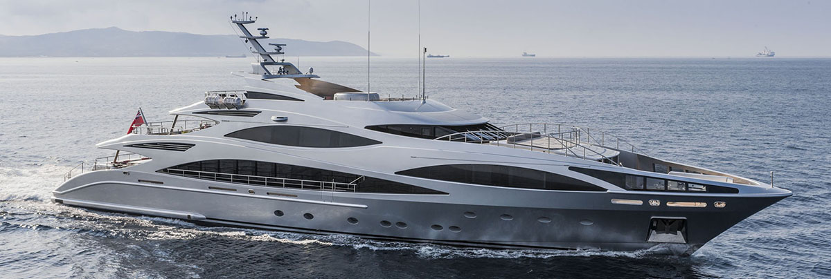 A gorgeous yacht motoring in a bay with a yacht financing company