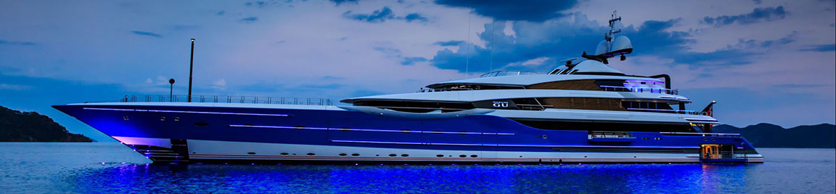 A beautiful mega yacht at dusk, bought with a mega yacht loan