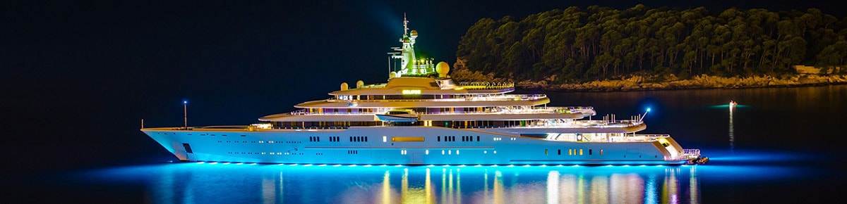 A superyacht at night, purchased through yacht financing
