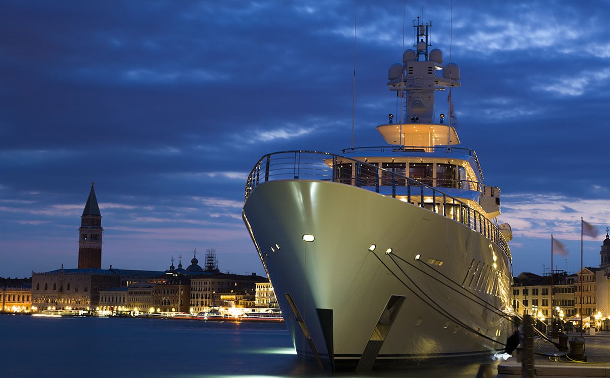 A mega yacht harbored in an European city with a yacht financing lender