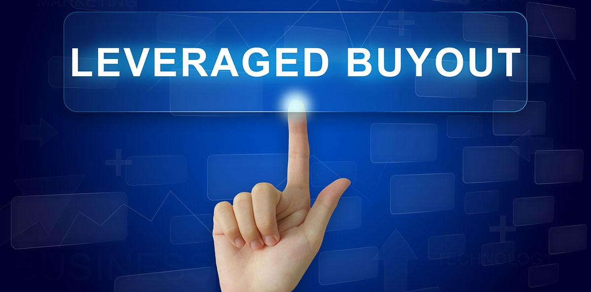 A hand points to a leveraged buyout sign 