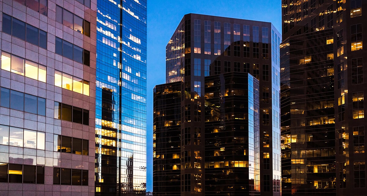 Glass skyscrapers at evening with beautiful reflections